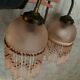 Paire d’appliques murales en verre rose et pampilles