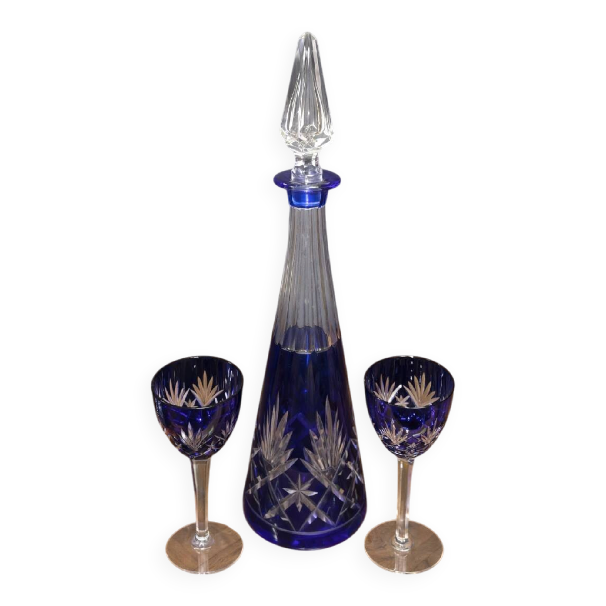 Cobalt blue double crystal service, consisting of a decanter and two matching glasses.