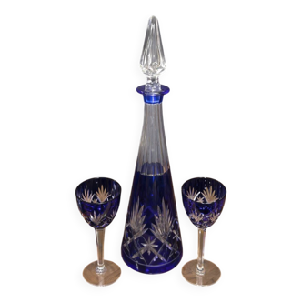 Cobalt blue double crystal service, consisting of a decanter and two matching glasses.