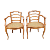 Paire de fauteuils canné bois blond années 60