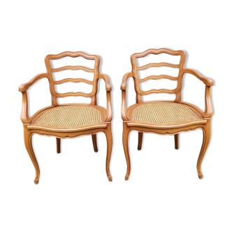 Paire de fauteuils canné bois blond années 60