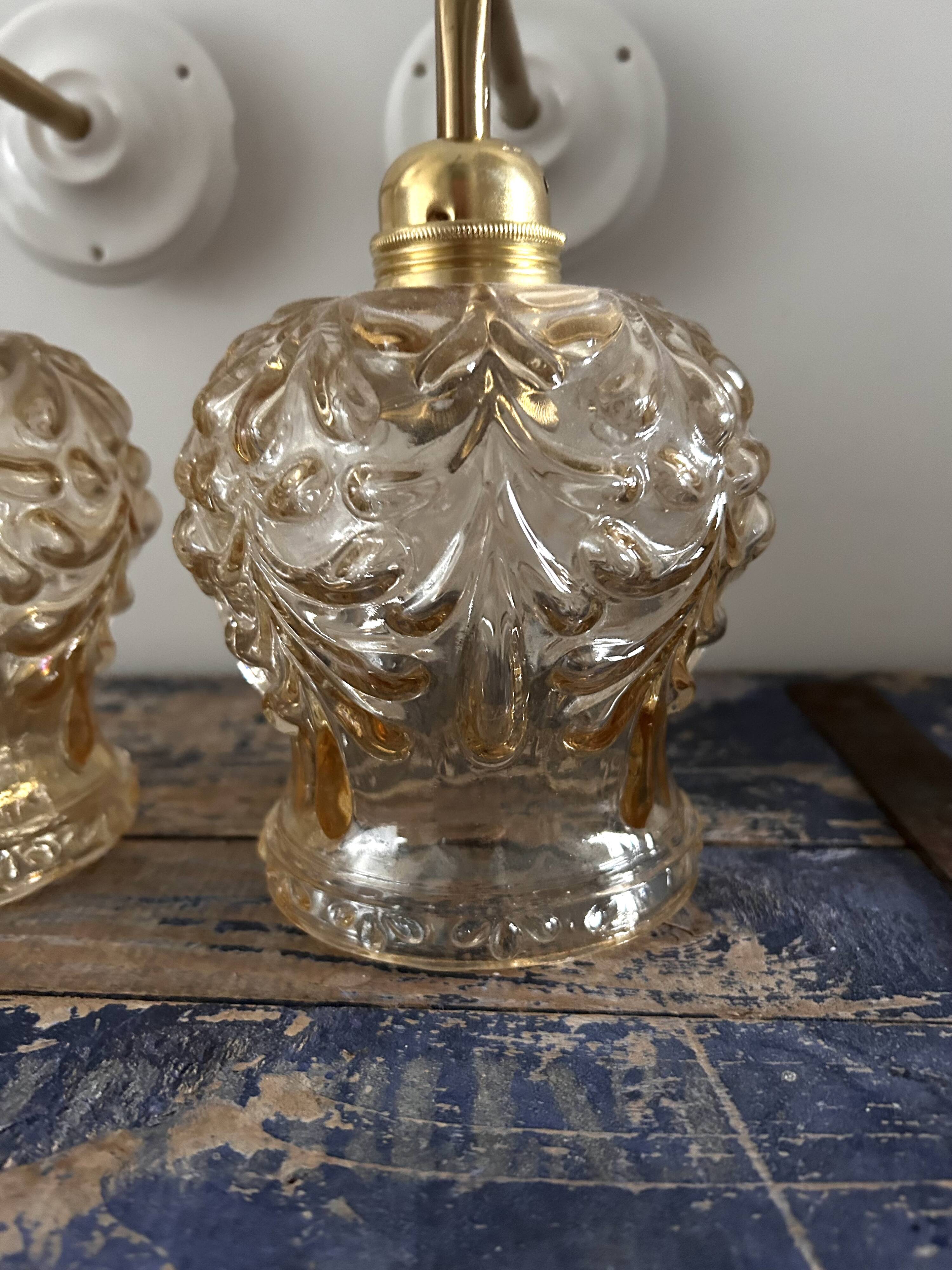Set of two vintage amber glass wall lights