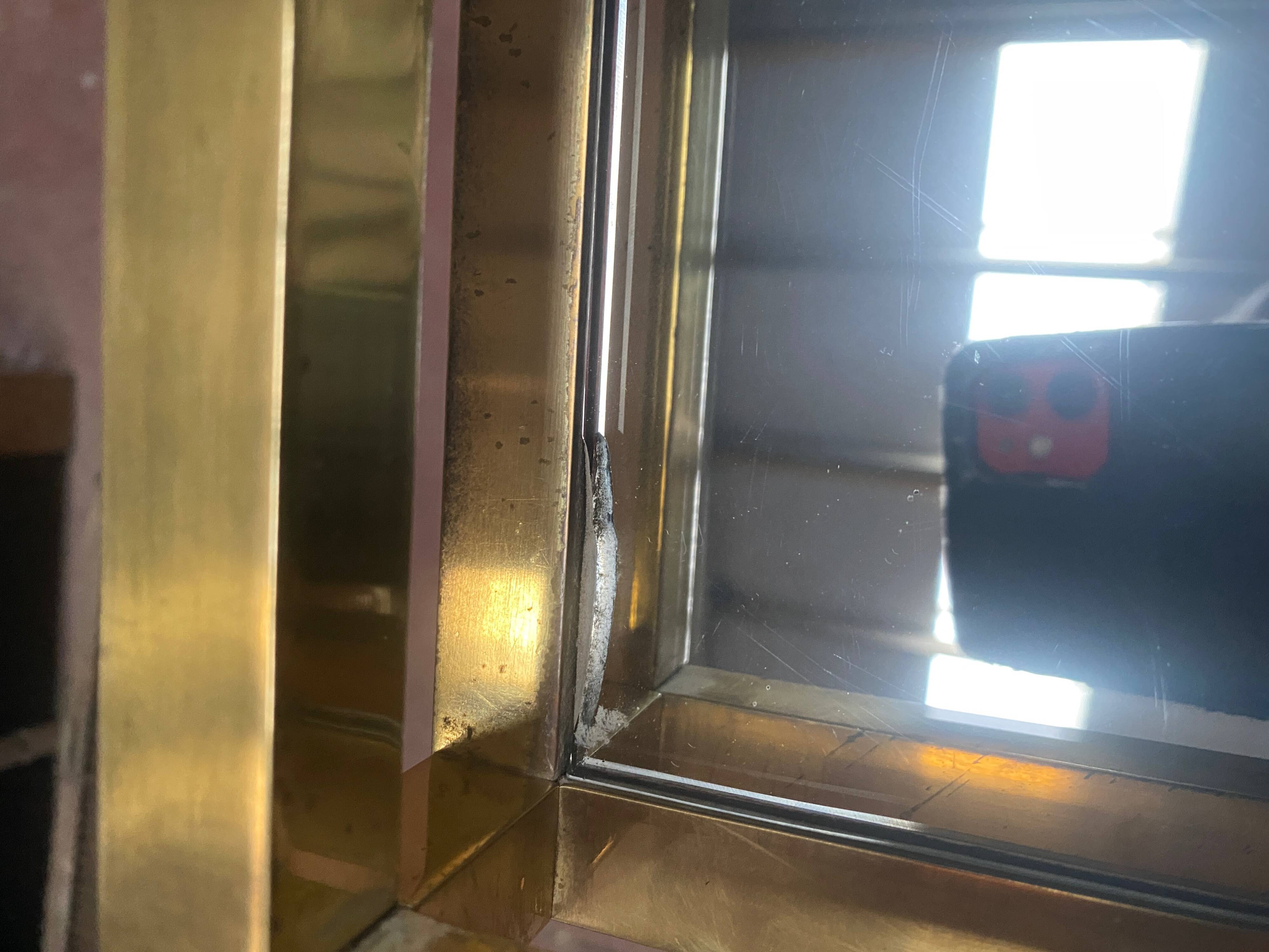 1970s brass bar with a mirrored front from the 20th century.