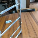 Chrome-plated brass magazine rack circa 1970