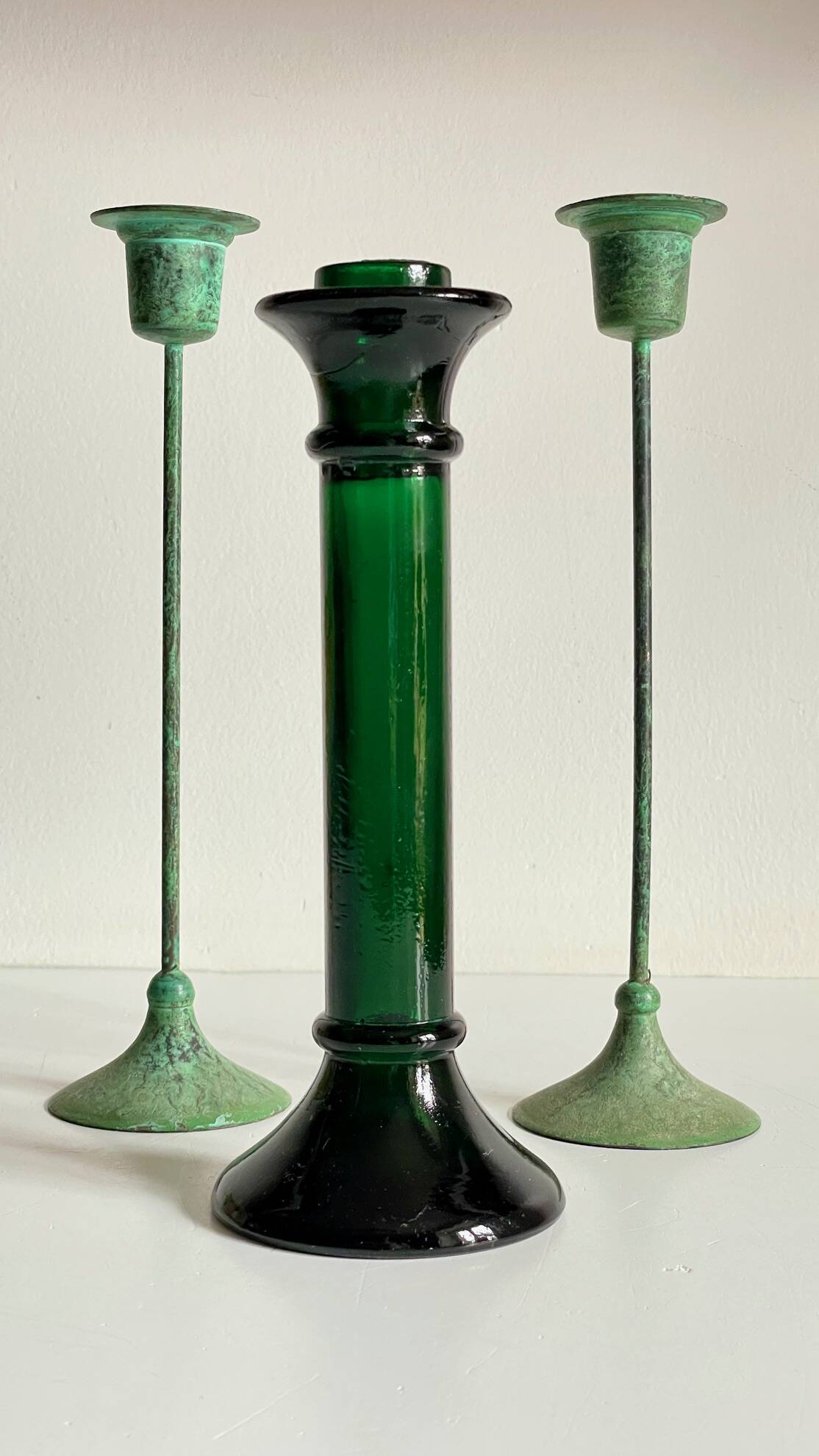 Green glass and metal candle holders
