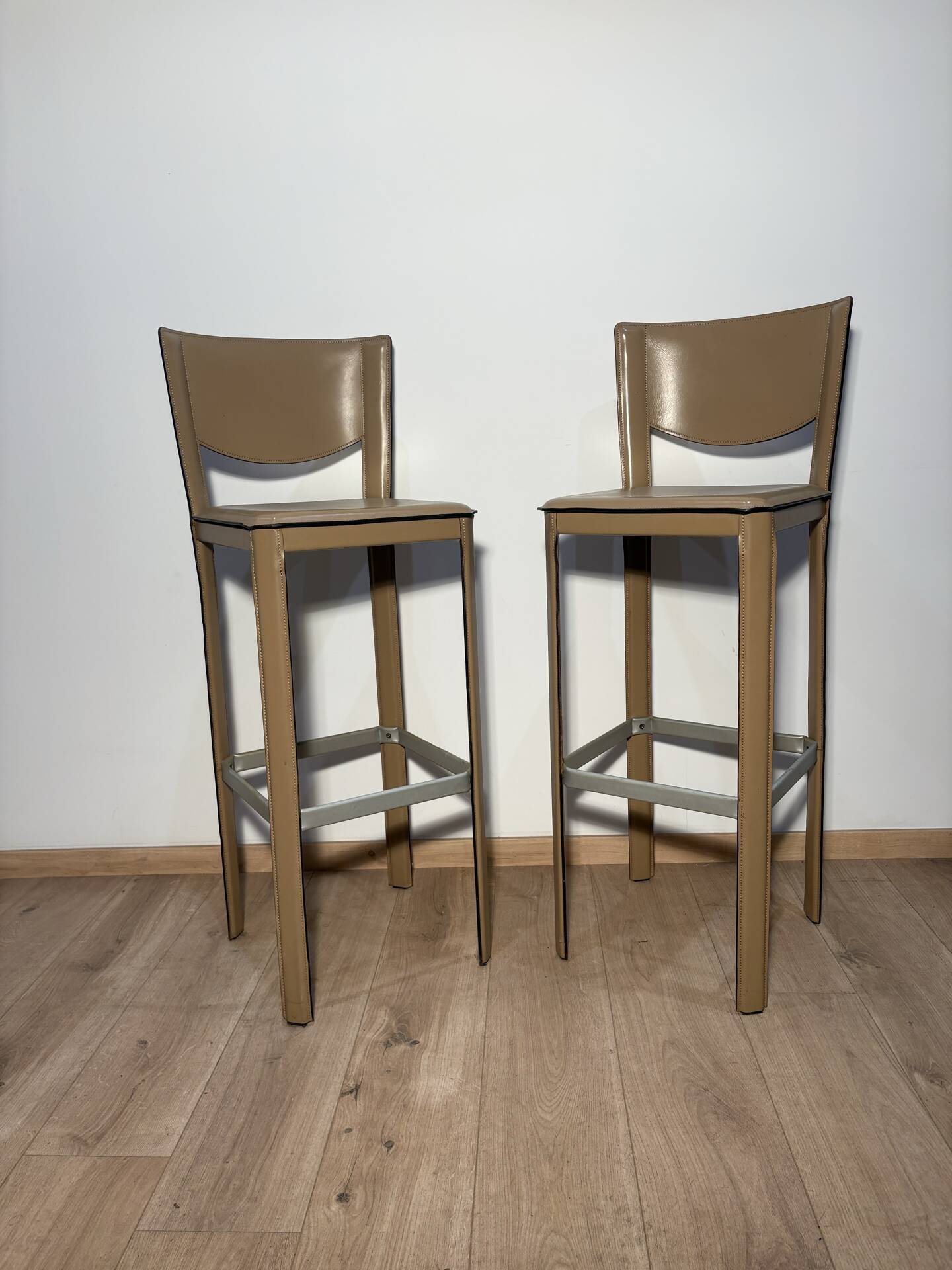 Pair of leather stools Enrico Pellizoni