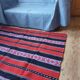 Traditional rustic red wool rug with stylized design and stripes, authentic hand-woven 160x230cm