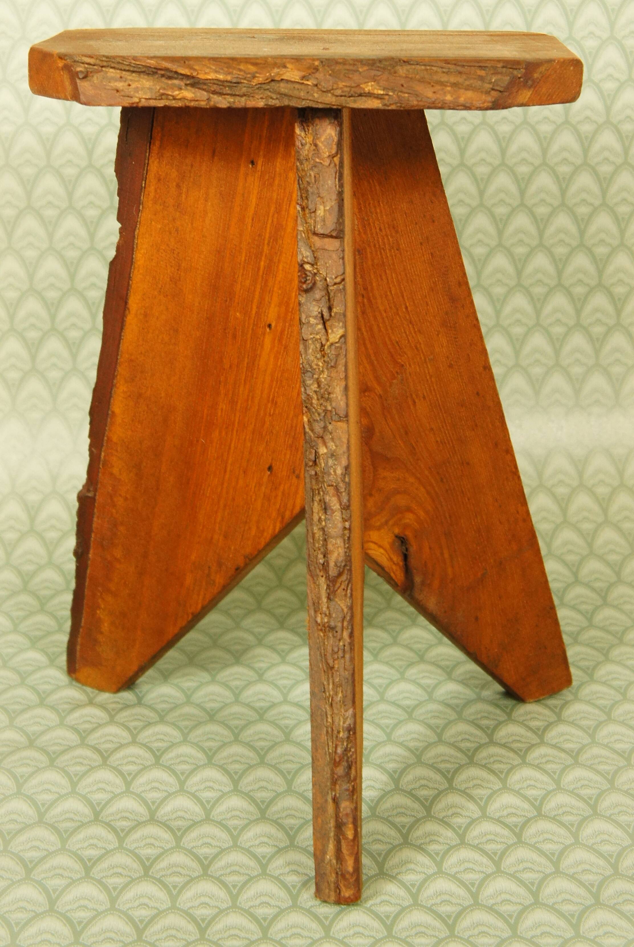 Brutalist stool tripod feet cross