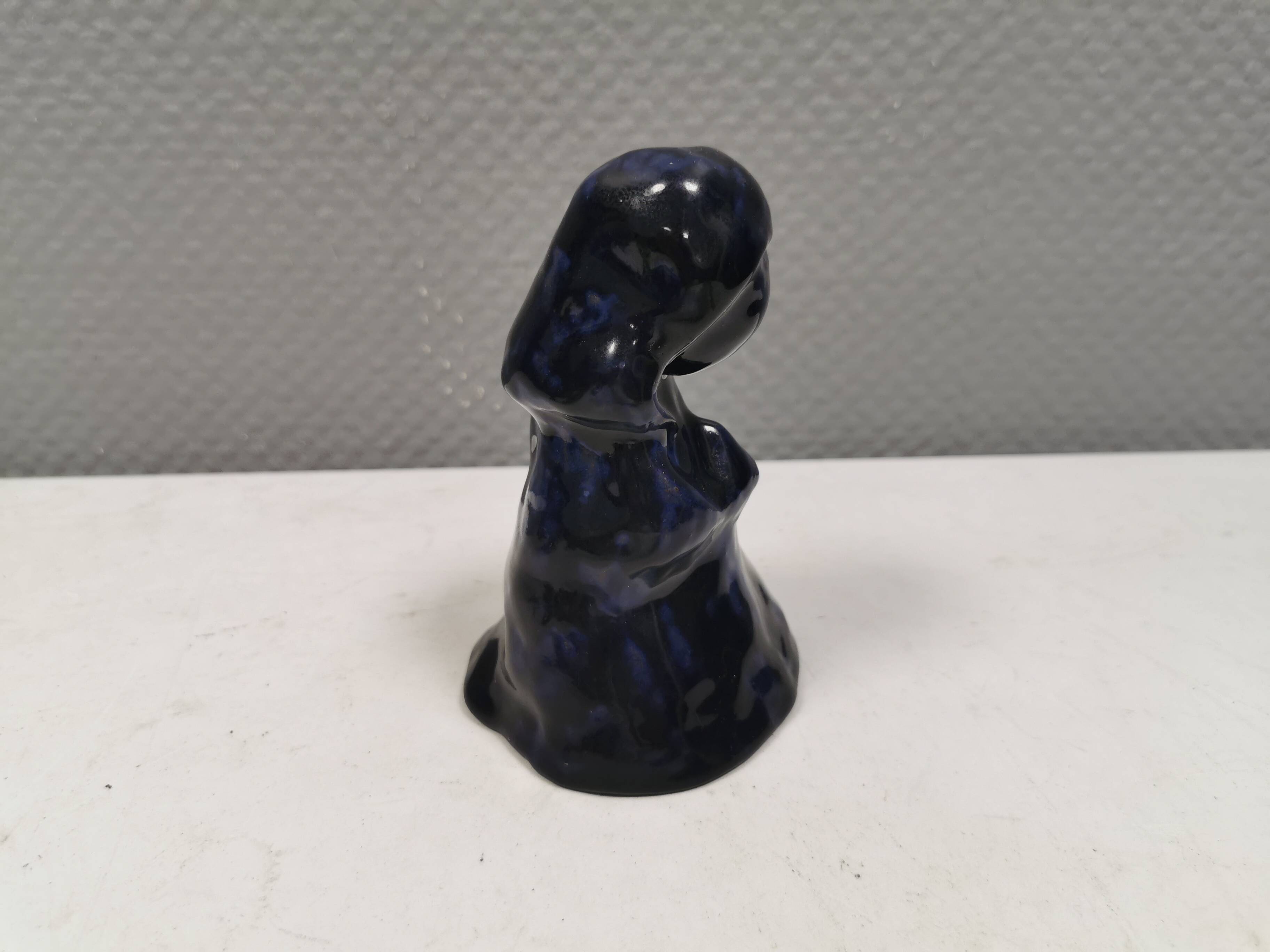 Lady figure in earthenware with shiny blue glaze