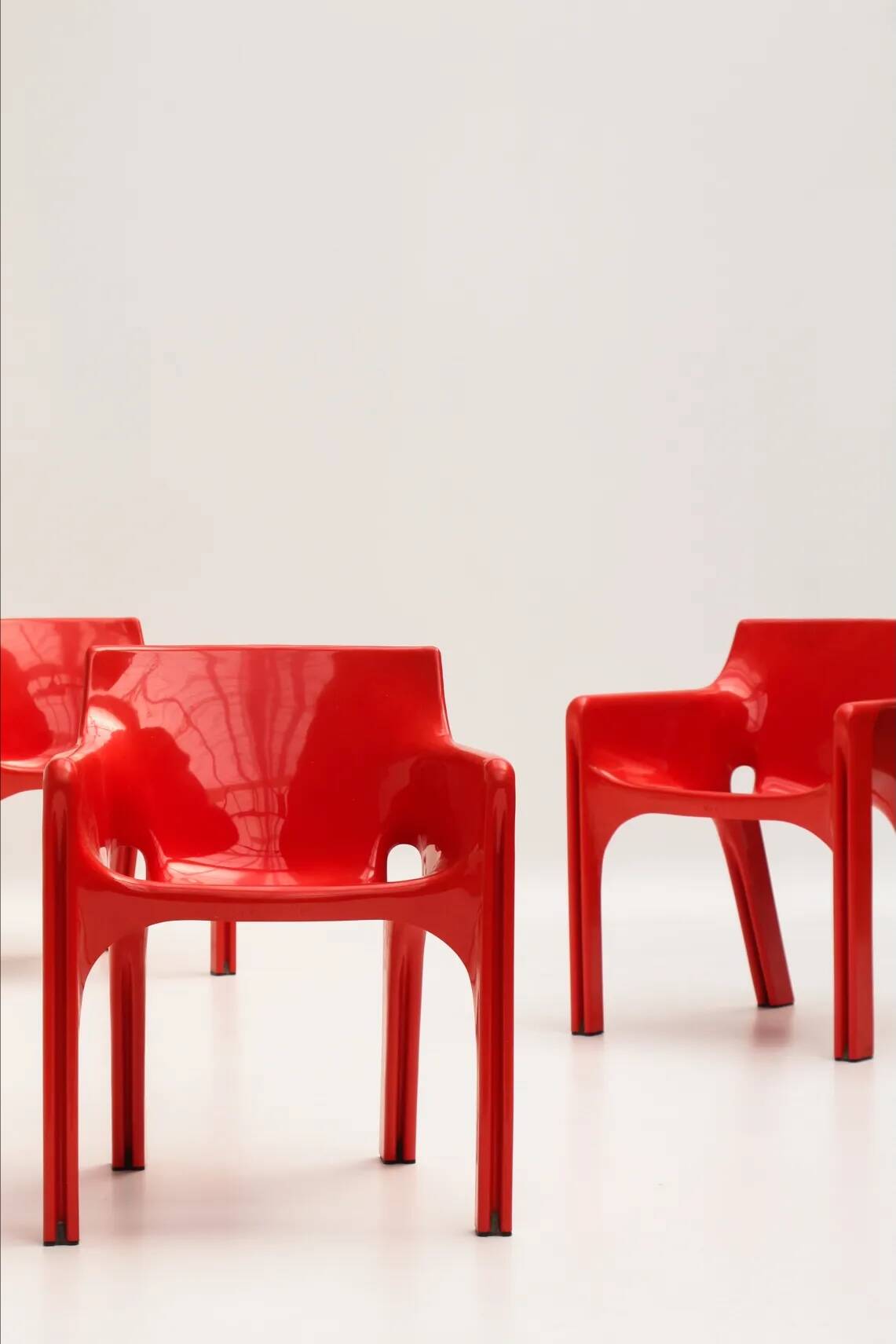 Set of 4 red "Gaudi" armchairs by Vico Magistretti for Artemide