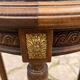 Old wooden pedestal table with marble top