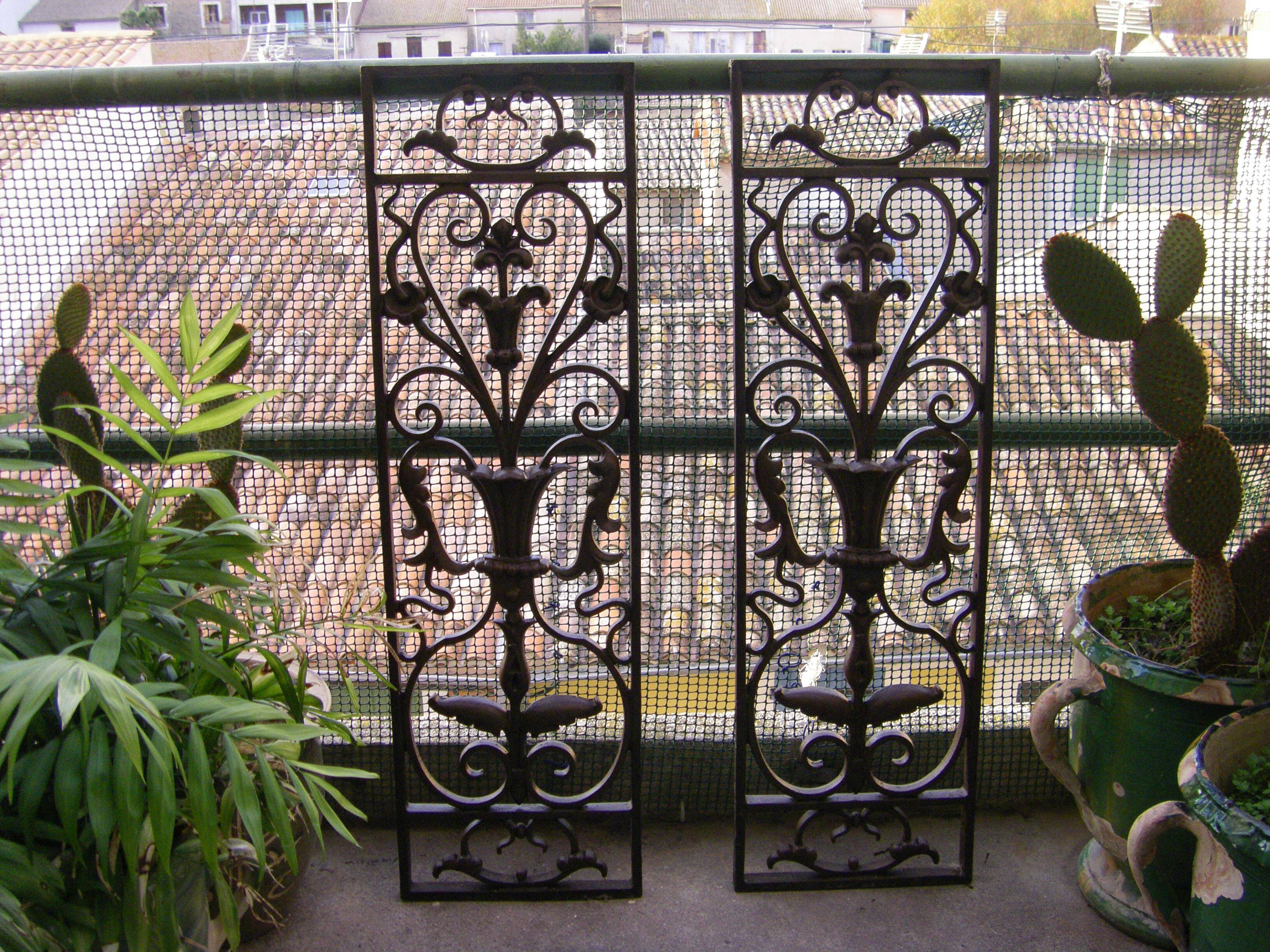 Pair of wrought iron door grilles from Dammarie