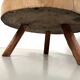 Brutalist coffee table in solid teak, monolithic slab, tripod base.