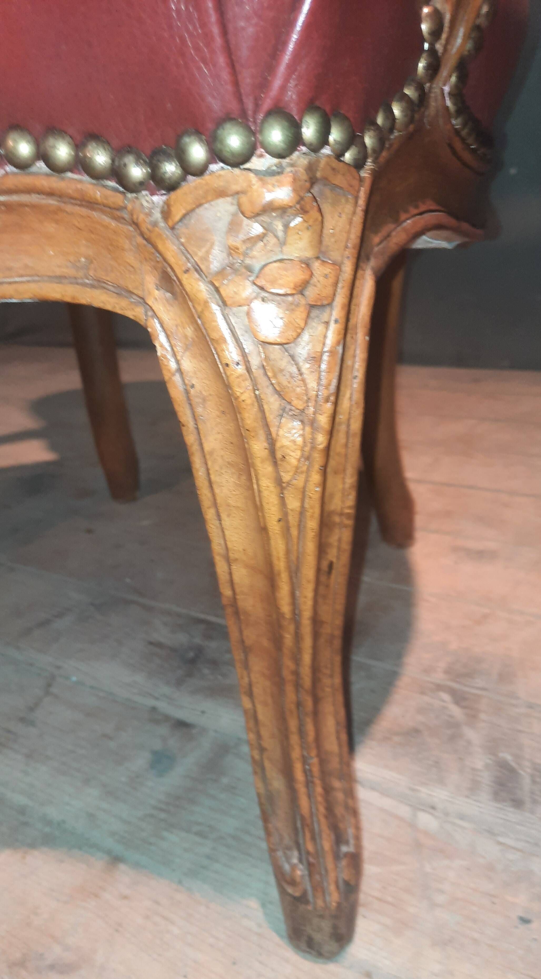 Louis XV period armchair covered in leather.