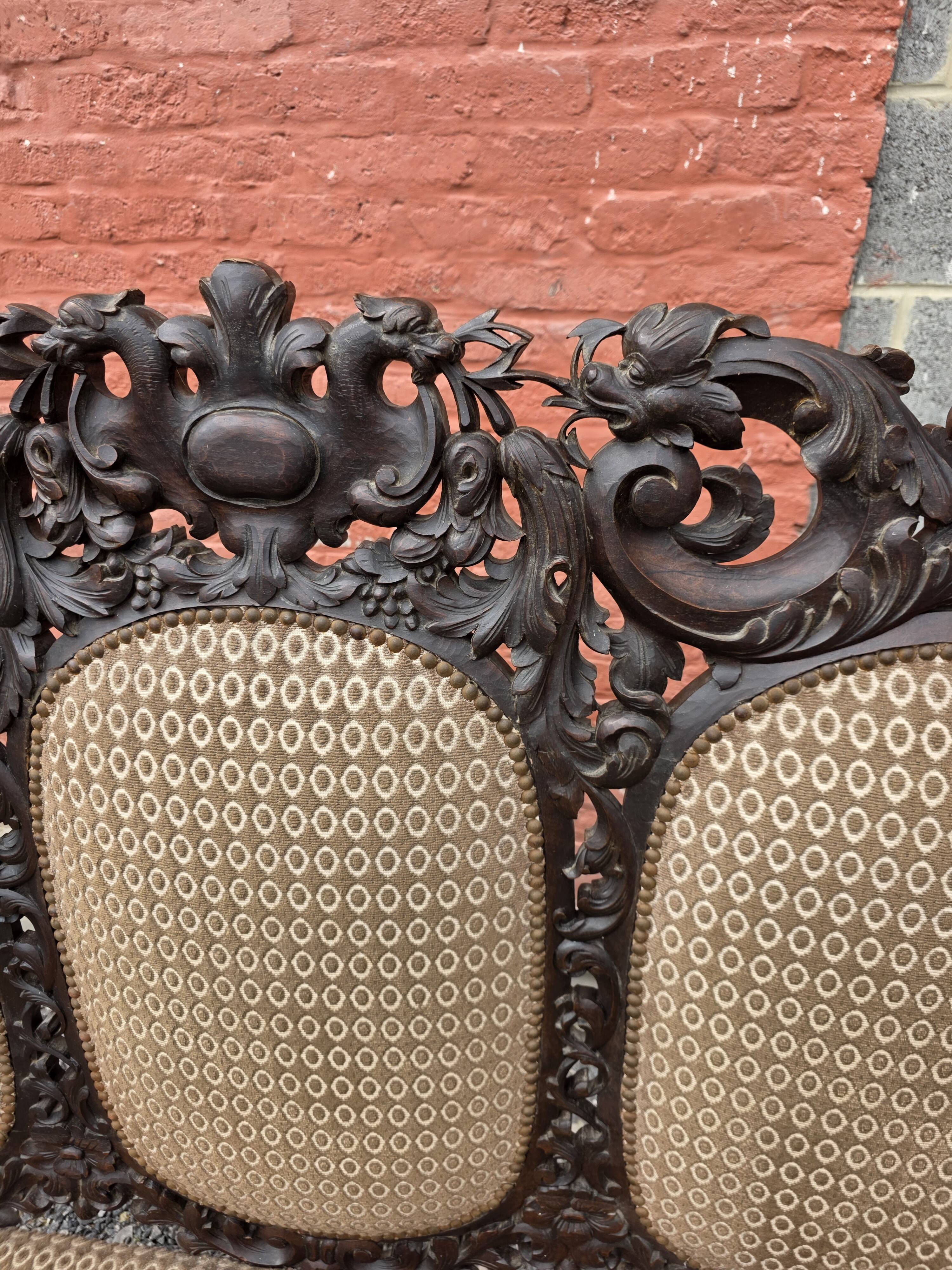 Three-seater armchair in Louis XIII style made of oak from the 19th century.