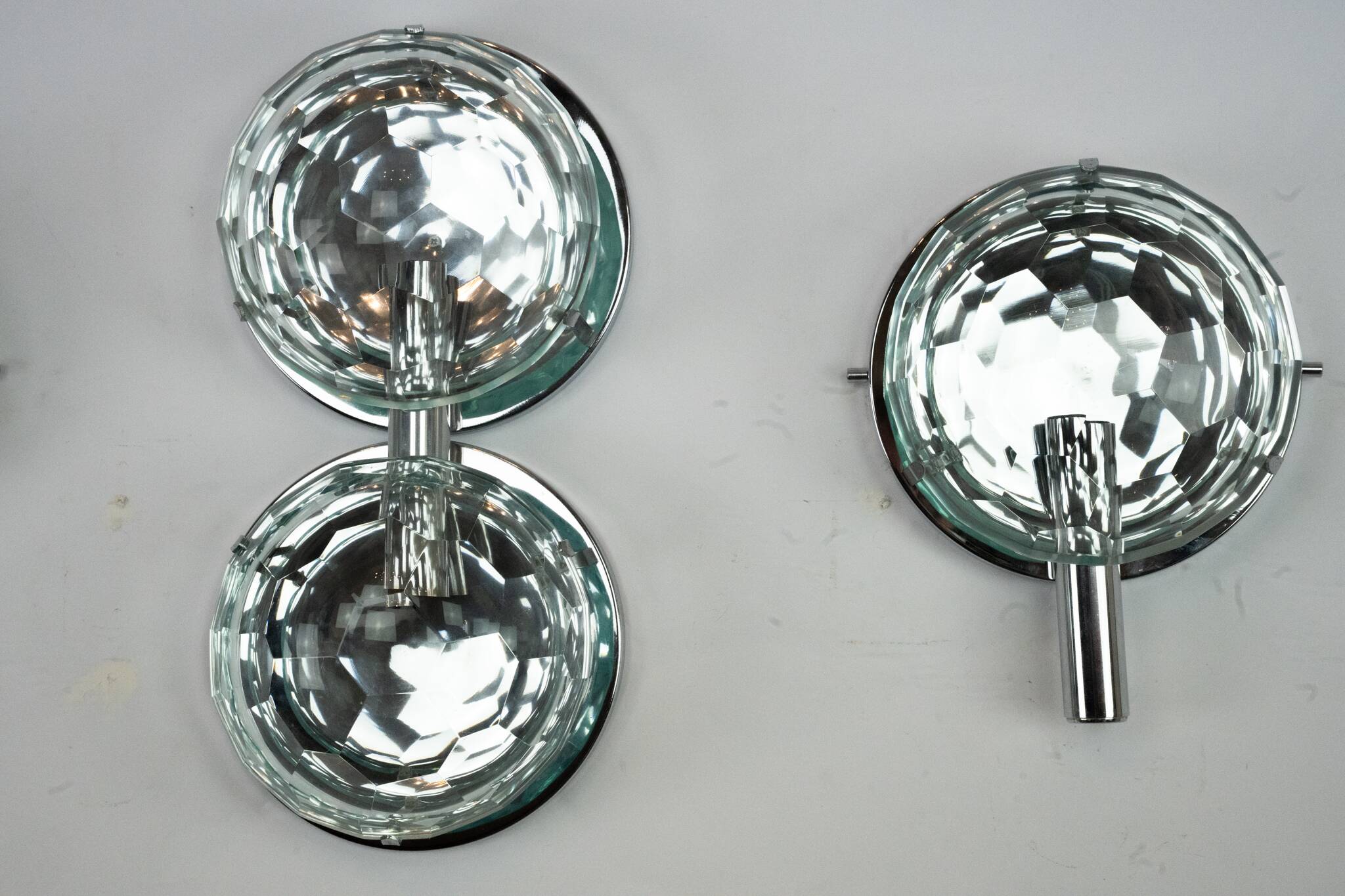 Set of three Cristal Art sconces in chrome and cut glass. Italy 1970s