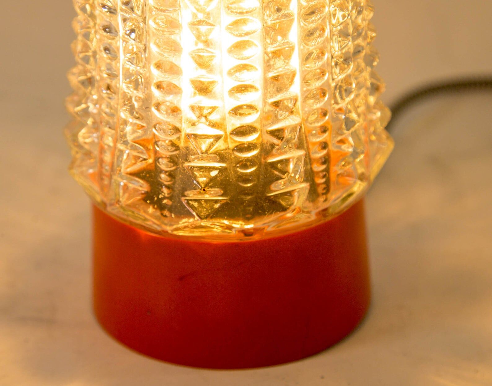 Built-in glass dome and vintage round orange base from the 70s