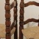 Pair of rustic chairs in turned wood with straw seats