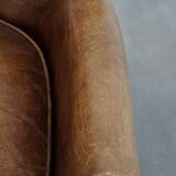 Nice, subtle cowhide armchair with a reversible kilim seat cushion