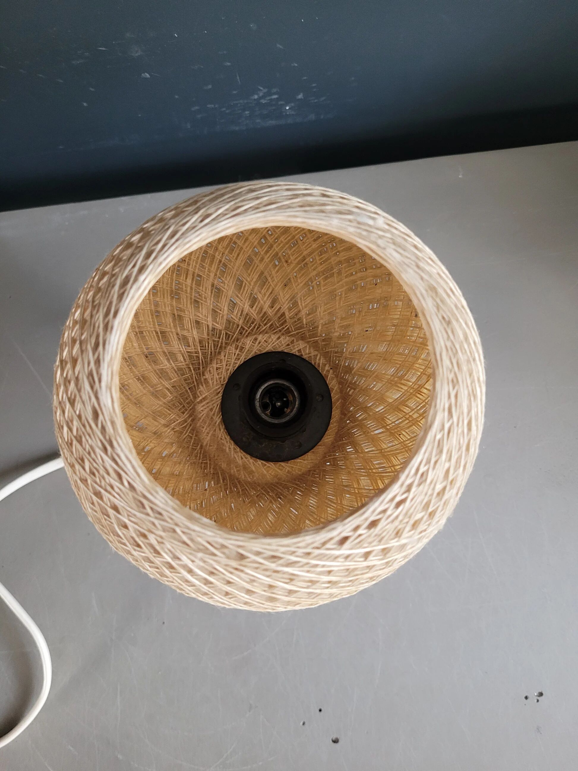 60's table lamp with tulip base and stretched wire shade.