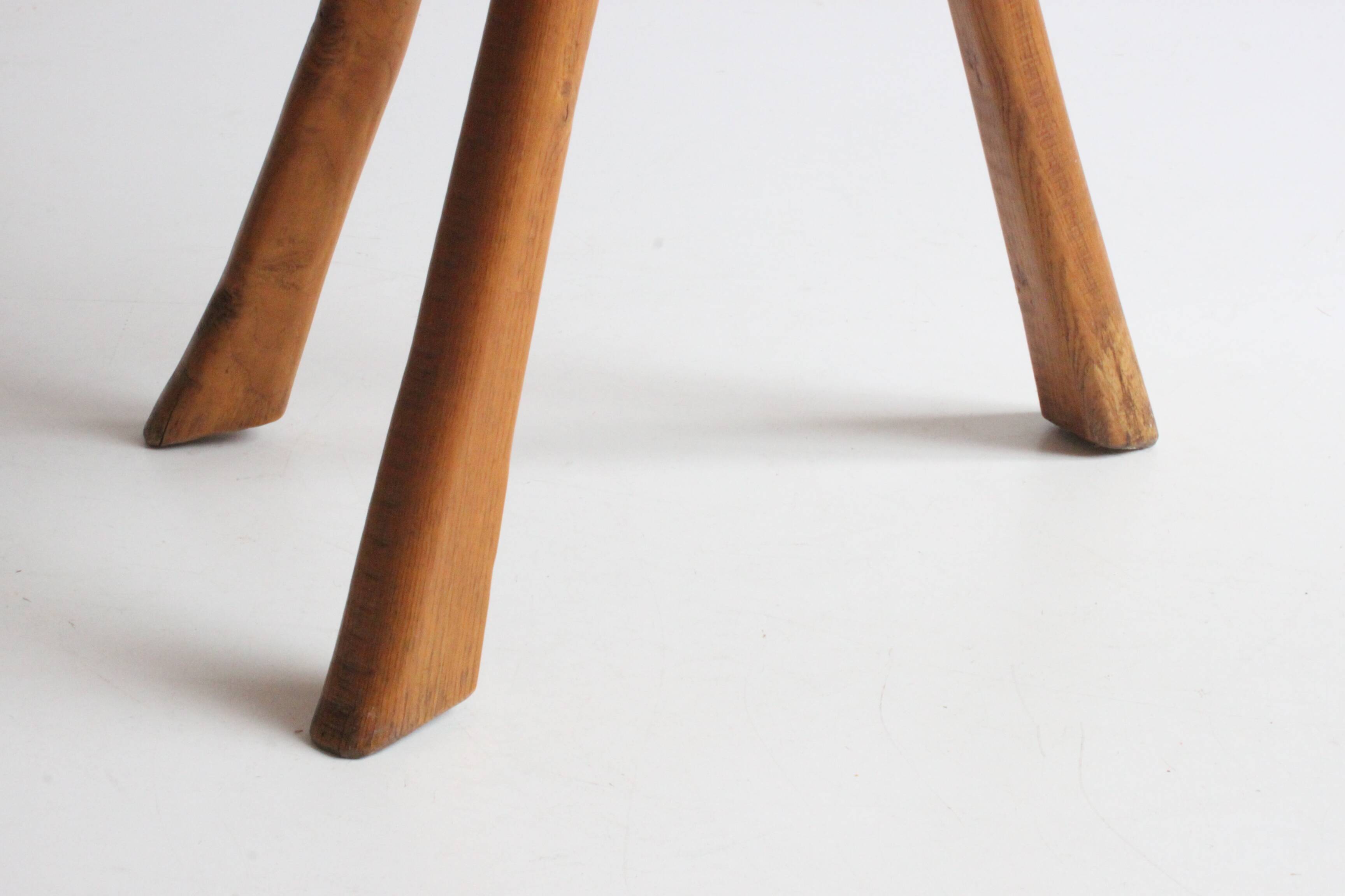 Brutalist tripod stool in carved wood, 1950s
