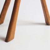 Brutalist tripod stool in carved wood, 1950s
