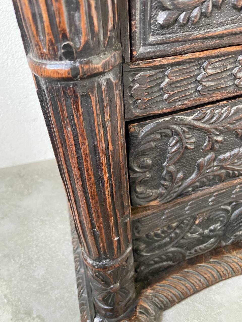 19th century chest of drawers in carved blackened pine