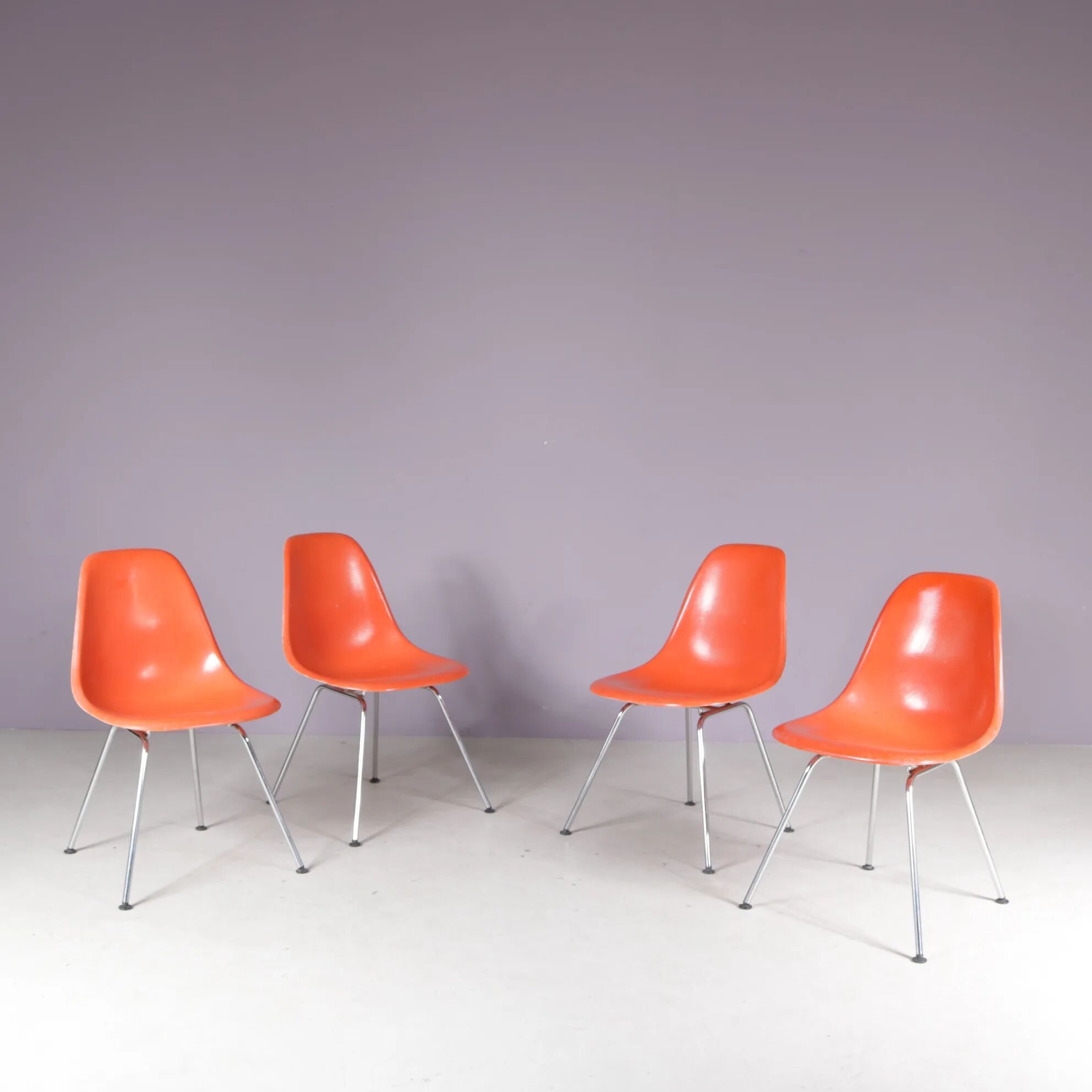 1960s dining chairs in orange fiberglass on chrome metal H-base / Charles & Ray Eames / Herman Miller, USA