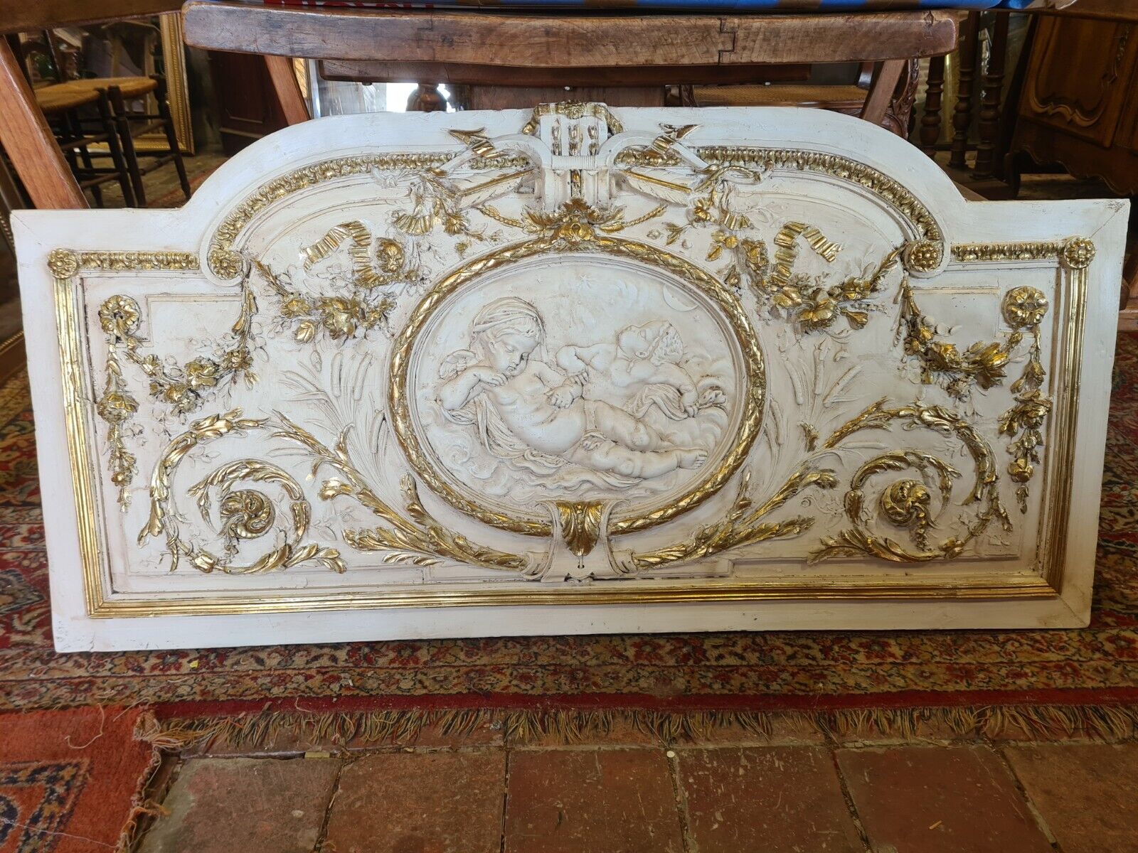 Pediment panel with stucco and wood angels