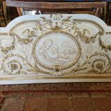 Pediment panel with stucco and wood angels