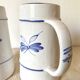 Flowery earthenware beer mugs