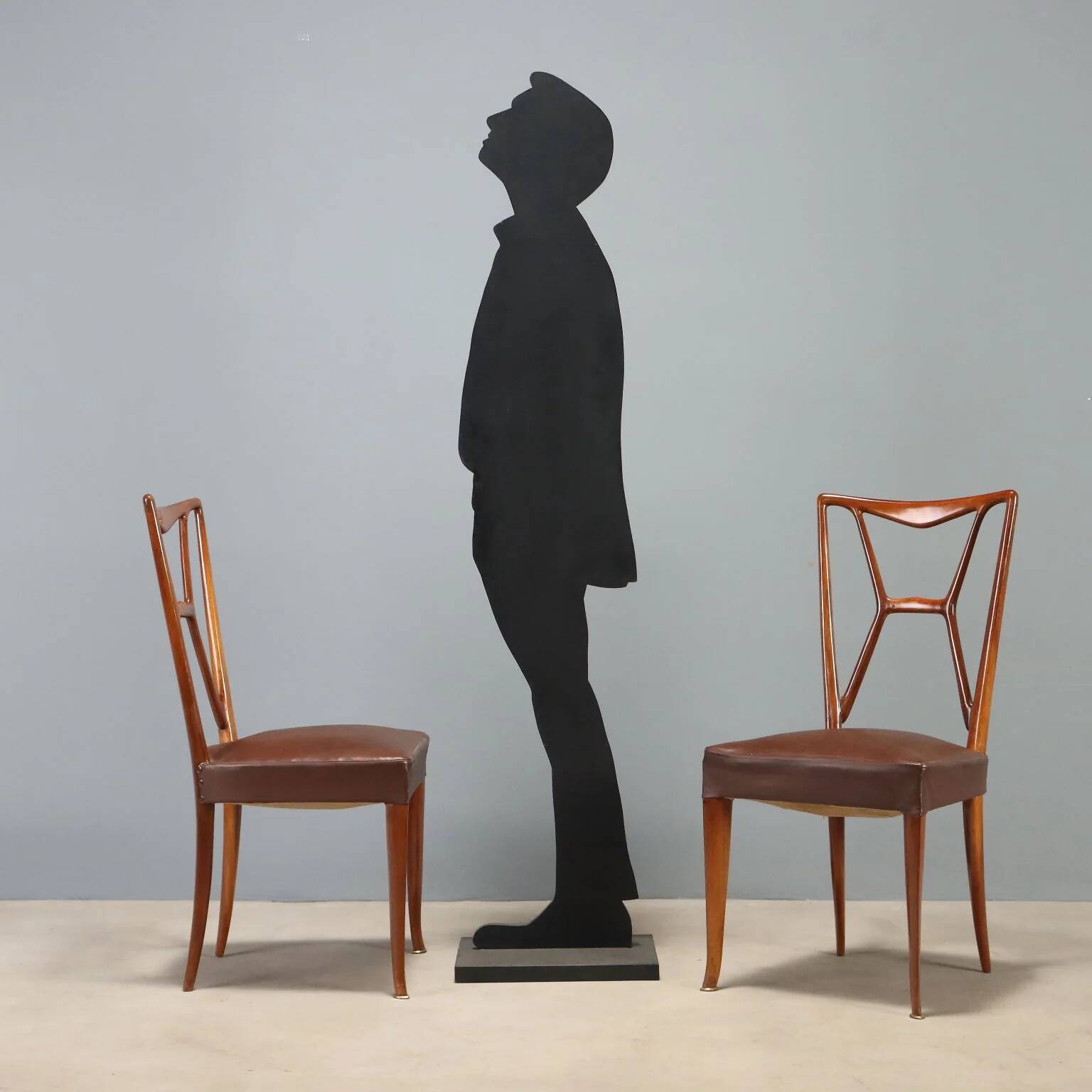 1950s chairs with wooden backs.