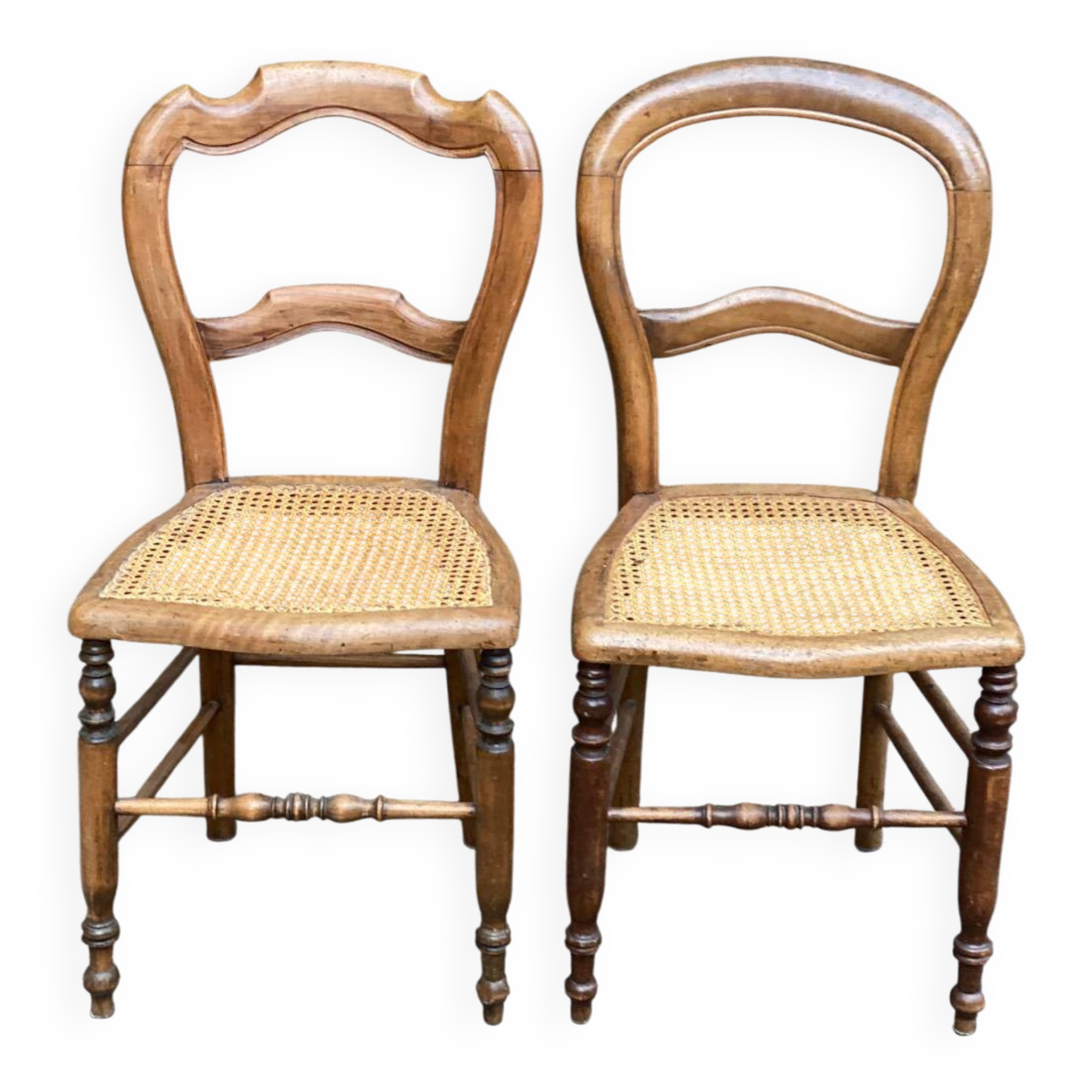 Two Louis Philippe cane chairs in solid carved wood from the 20th century