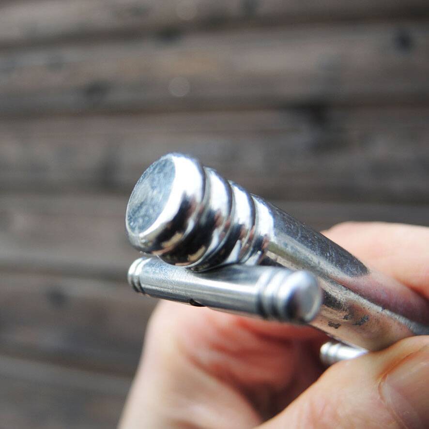 12 vintage Art Deco metal knife rests