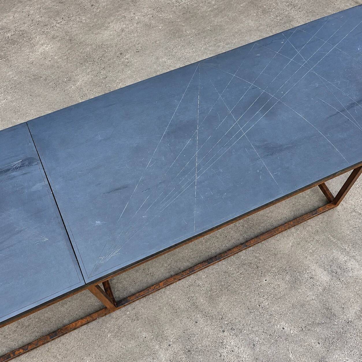 Weighty coffee table with solid iron frame and stone slate table tops, made on commission by architect Alex Vervoordt, Belgium 1990s