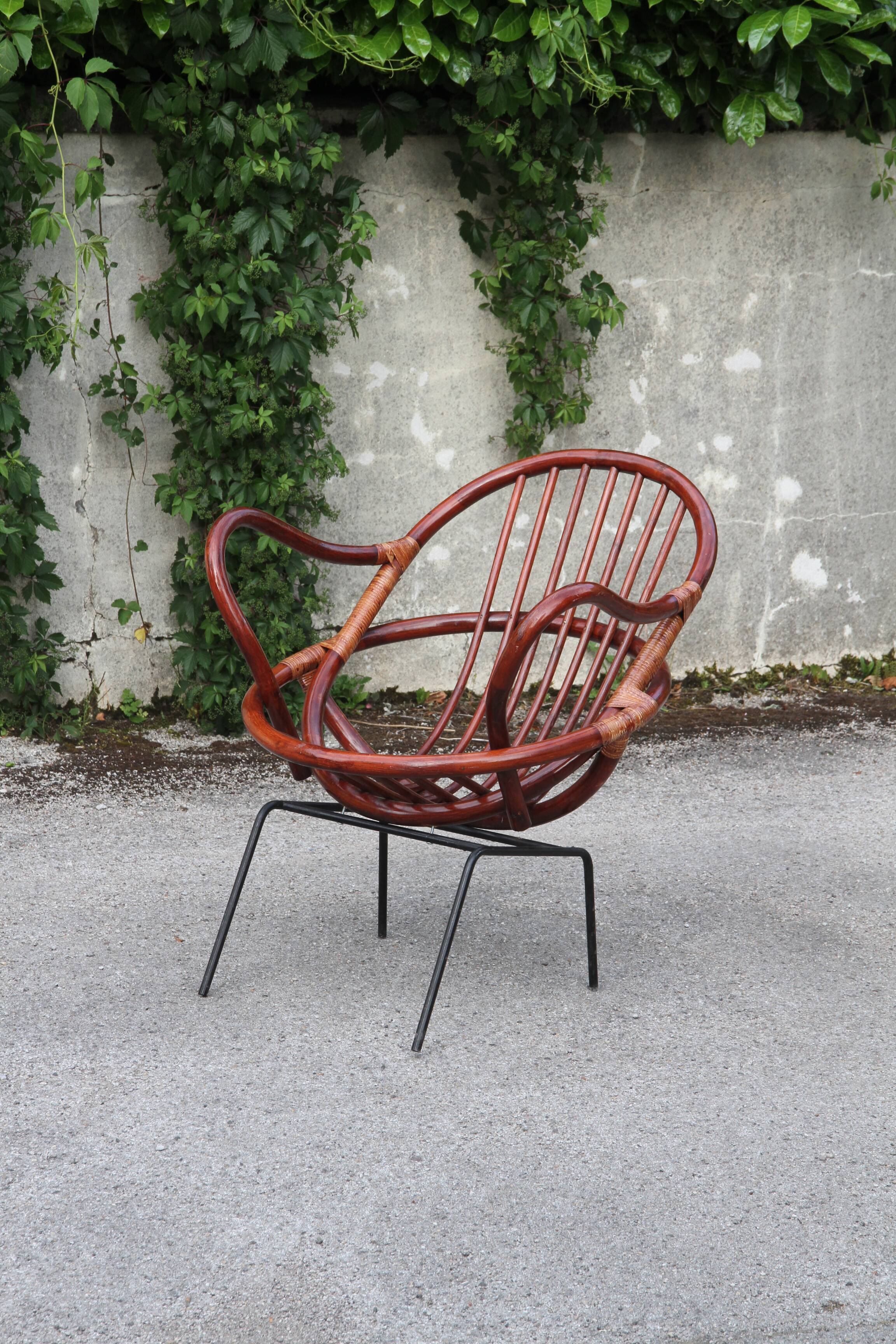 Rattan shell armchair with metal feet