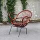 Rattan shell armchair with metal feet