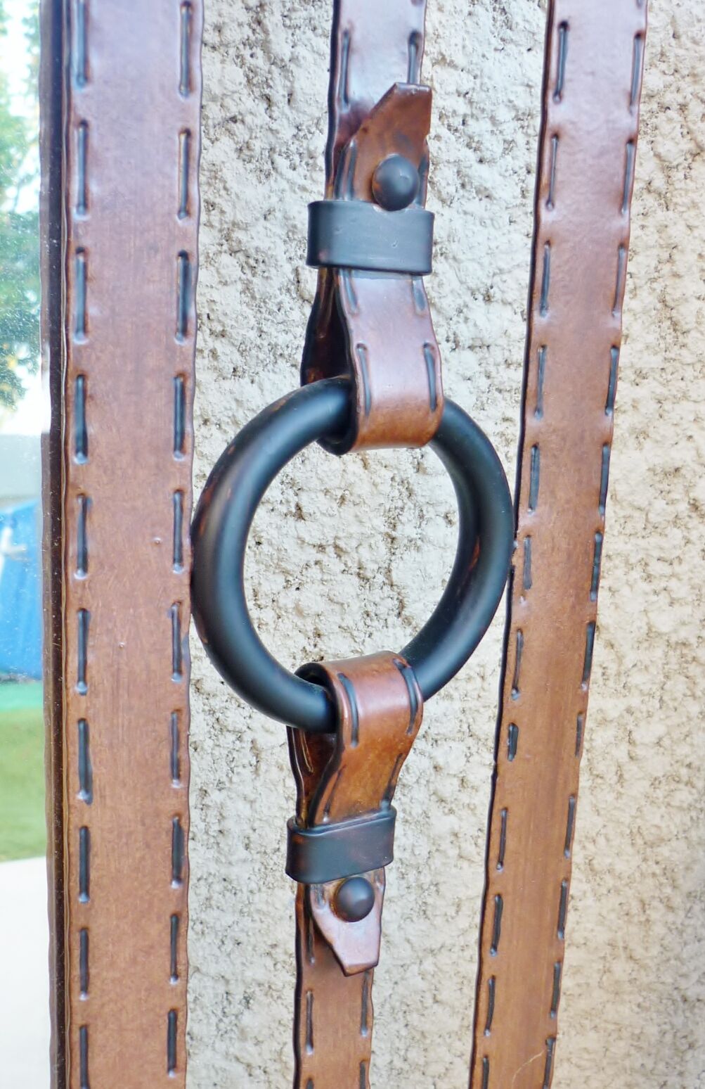 Metal mirror, wrought iron imitation leather straps and horse harness