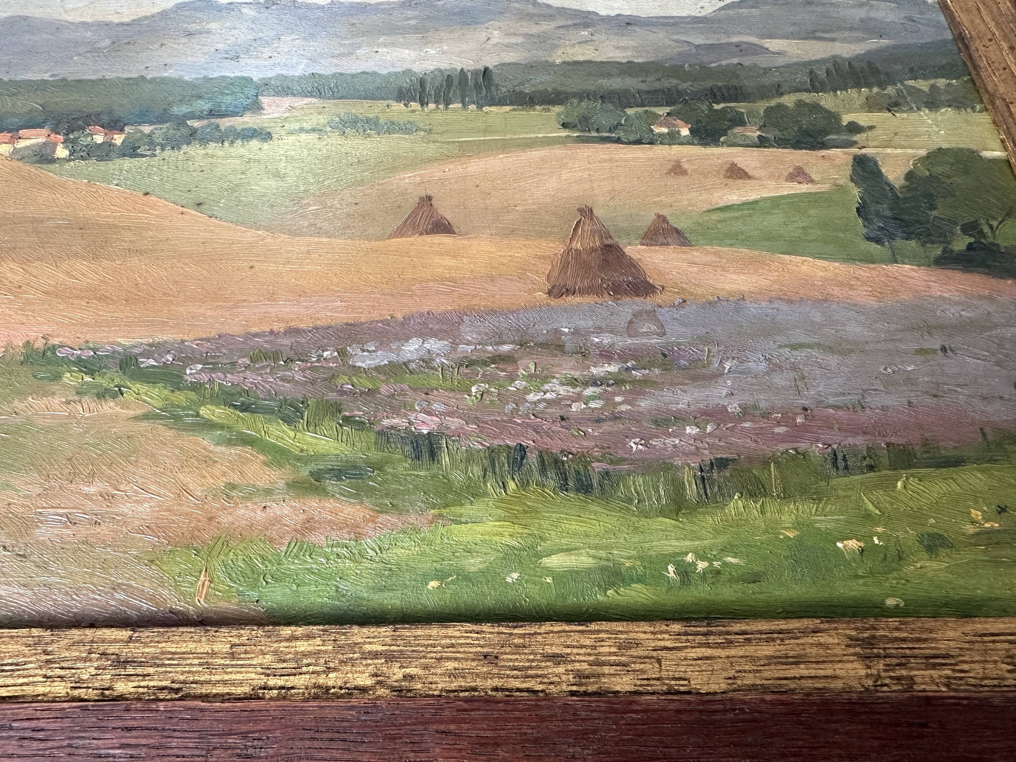 Old oil painting of a landscape on panel from 1920, haystacks.