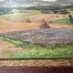 Old oil painting of a landscape on panel from 1920, haystacks.