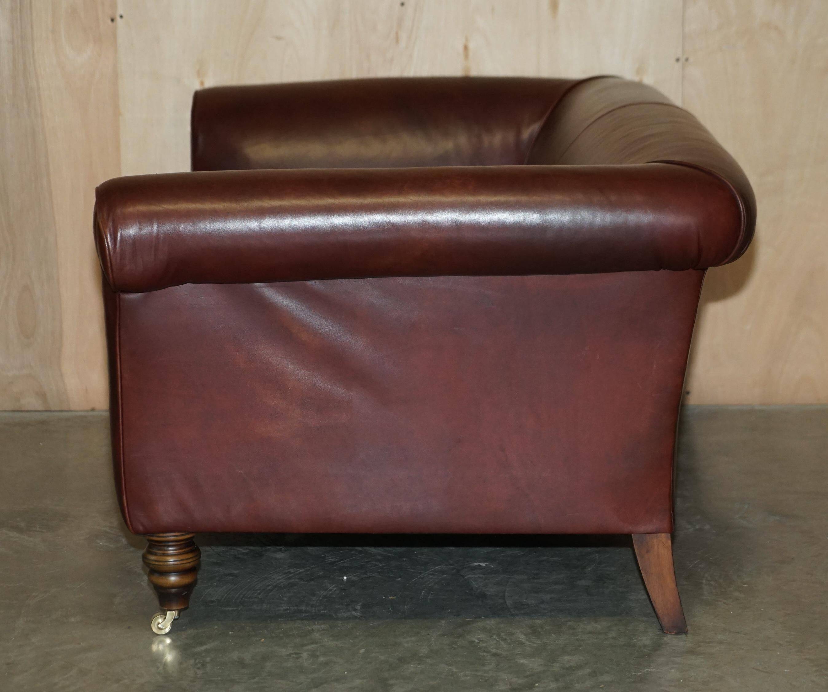 Vintage Art Deco leather sofa, three-seater, feather cushions.