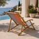 Vintage deck chair with orange and blue striped fabric, original patina.