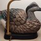 Decorative table lamp with a sculpted duck-shaped base and painted finish.