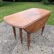 Large six-foot table with XIX century folding leaves in solid walnut Ø120 extendable to 330.