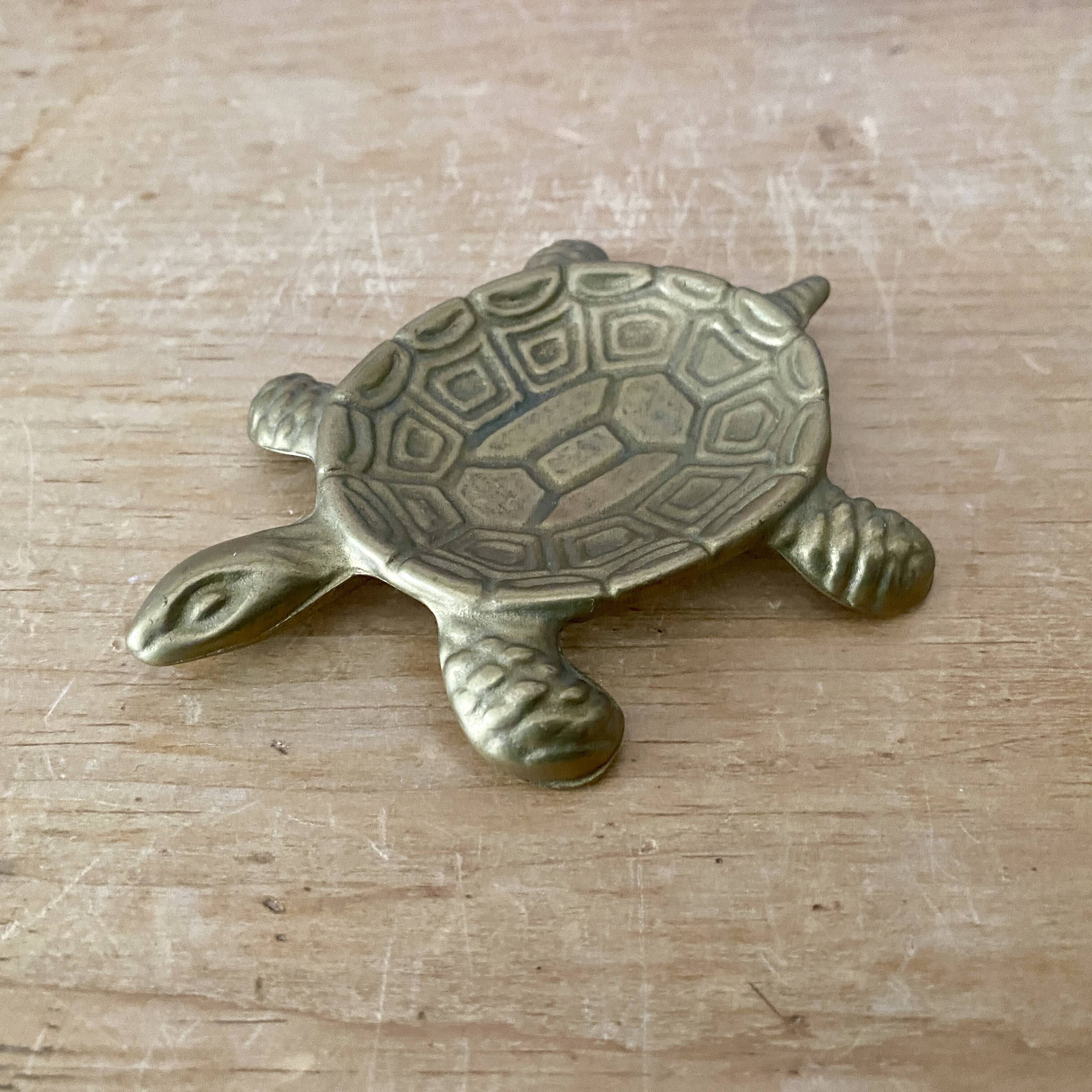Vintage brass turtle pocket emptier