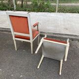 2 Louis XVI armchairs in solid wood and orange velvet.