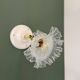 Vintage tulip glass wall light in transparent, slightly pearlescent white.