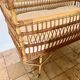 Vintage rattan baby bed with wheels