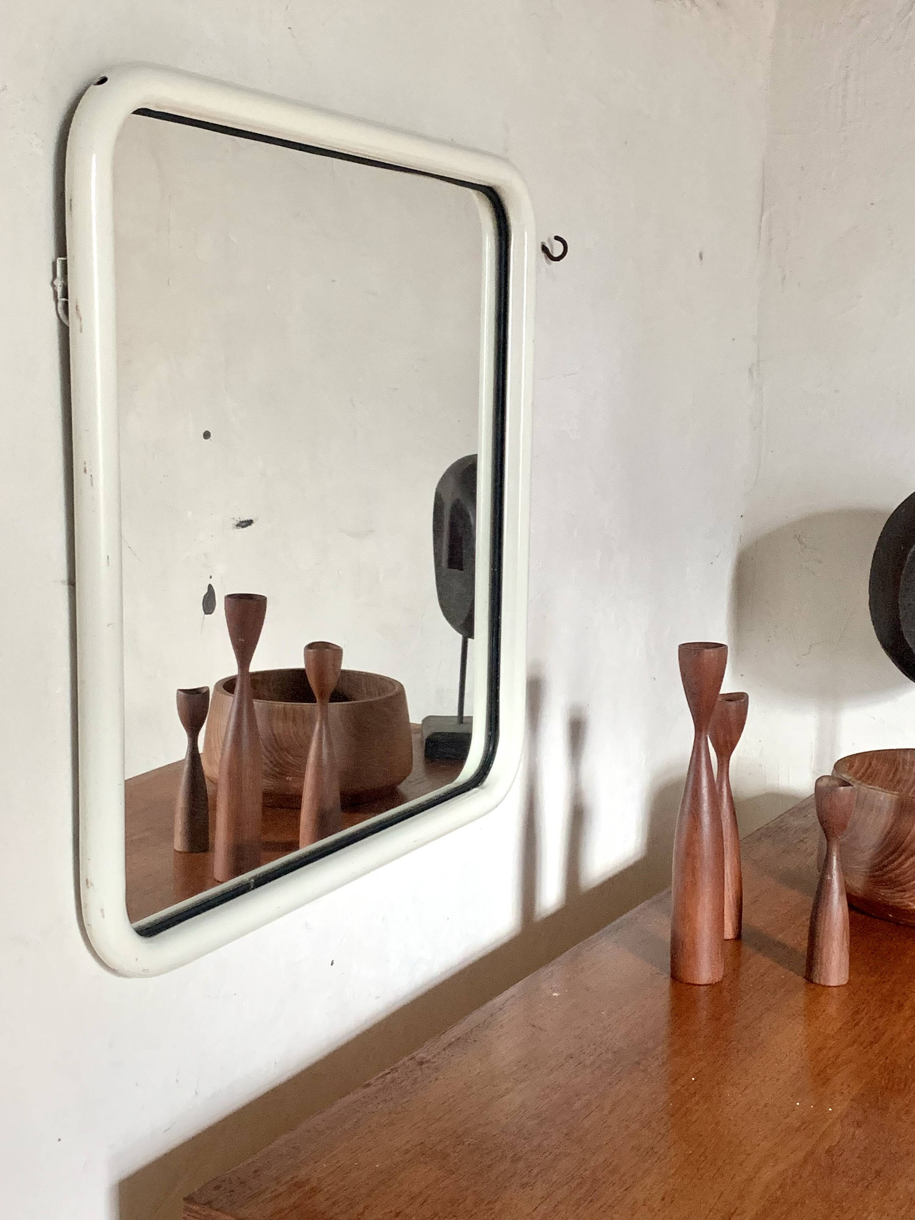 White tubular metal wall mirror