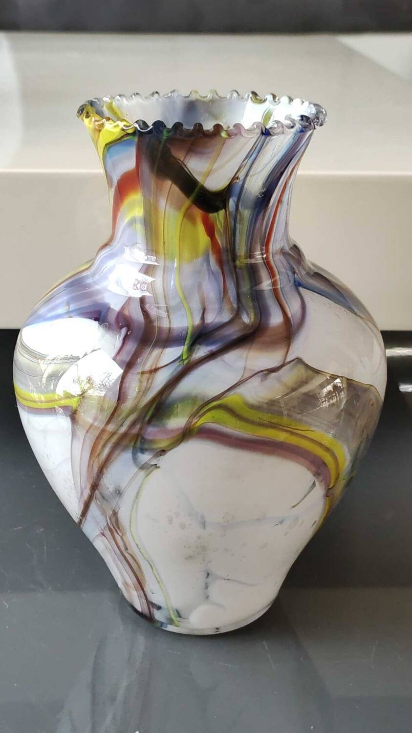 Blown Art glass ball vase from Murano/Italy. Decor swirls of smoke/polychrome waves. Dimensions 20 x 15 cm